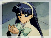 Umi holds an oriental cherry petal that has blown by